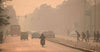 motorcyclist driving in smog